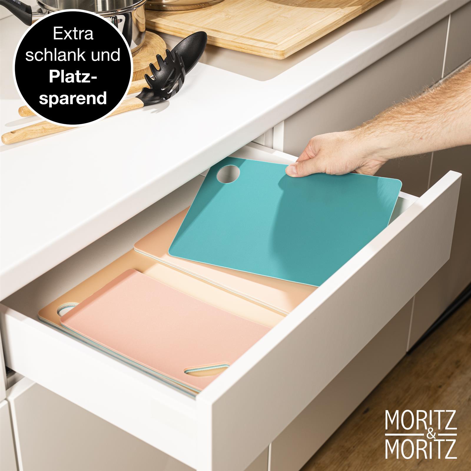 Bunte Schneideunterlage für kreative Projekte und präzises Arbeiten Bunte Schneideunterlage aus Kunststoff in rechteckiger Form mit grafischen Mustern, ideale rutschfeste Oberfläche für sicheres Schneiden in der Küche.