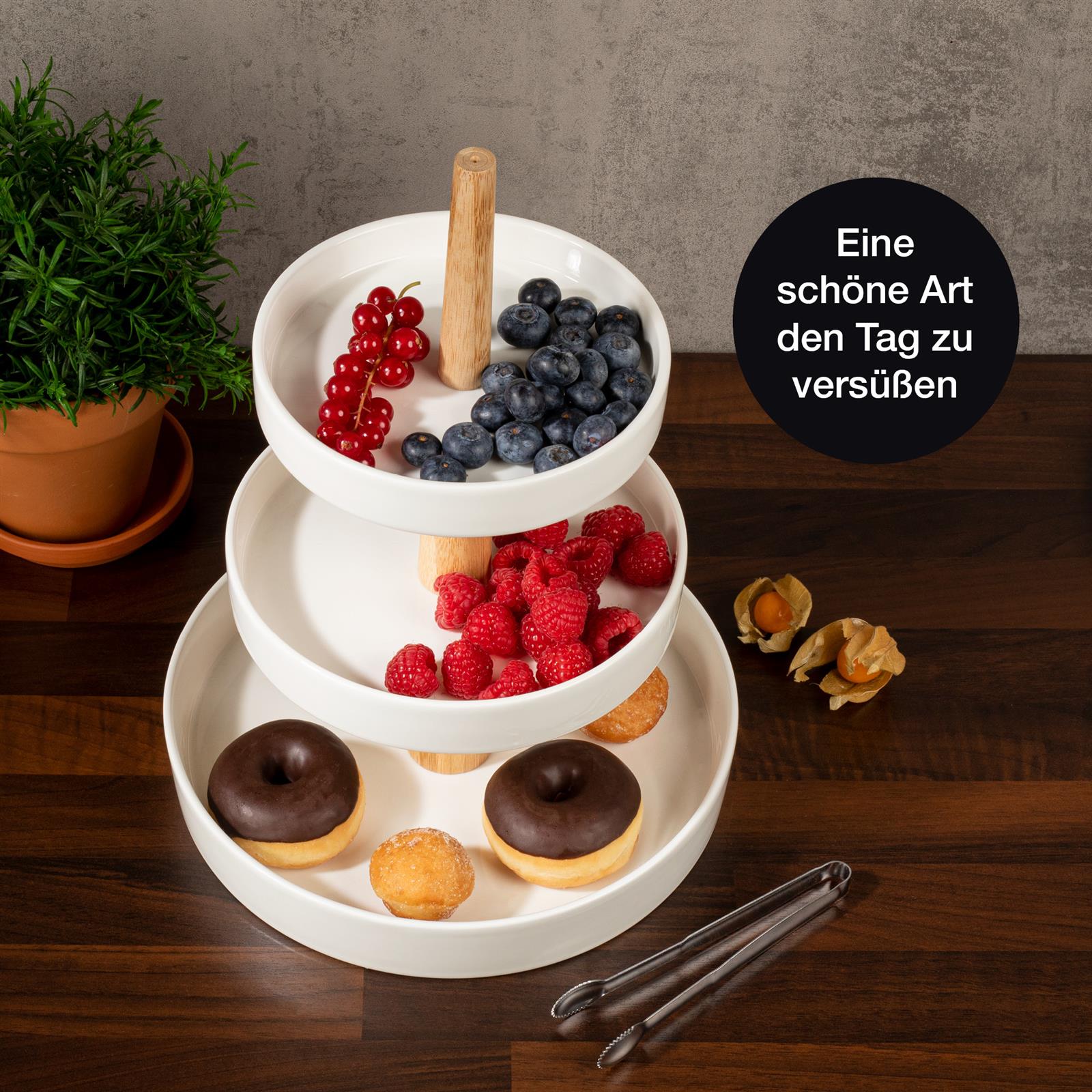 Weiße runde Etagere mit Holz-Elementen - Stilvolle Präsentation für Ihr Zuhause Runde weiße Etagere mit Holzdetails, dreistufiges Design, ideal für stilvolle Präsentationen von Gebäck, Kuchen oder Fingerfood.