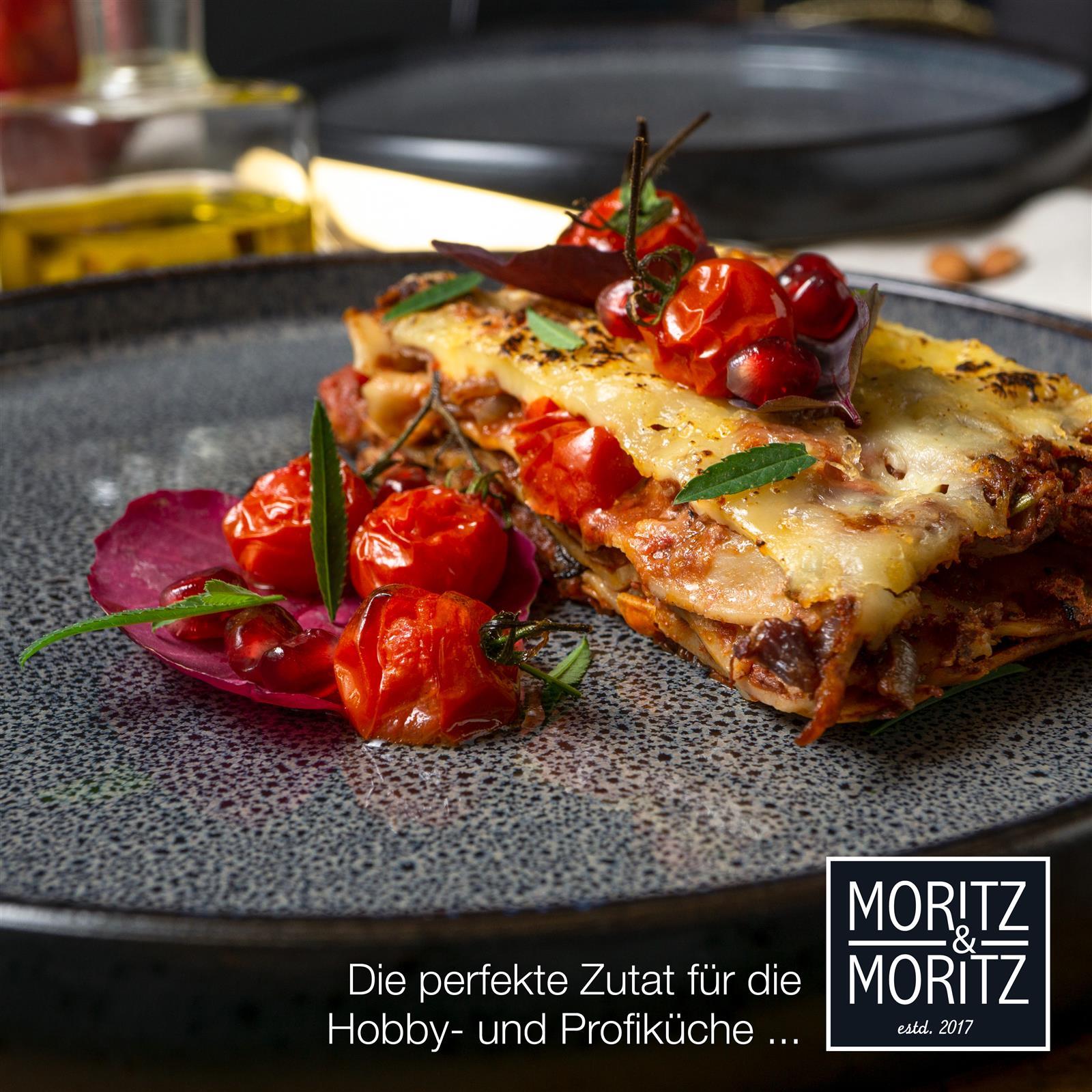 18-teiliges Gourmet-Teller-Set in Grau, auf gedecktem Tisch bei Tageslicht