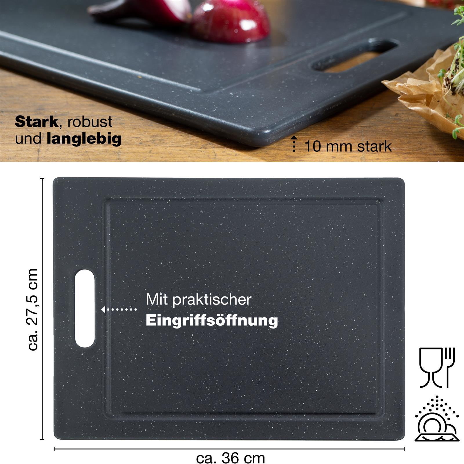 Rechteckiges Schneidebrett aus schwarzem Granit mit abgeschrägten Kanten, liegend auf heller Oberfläche, Design