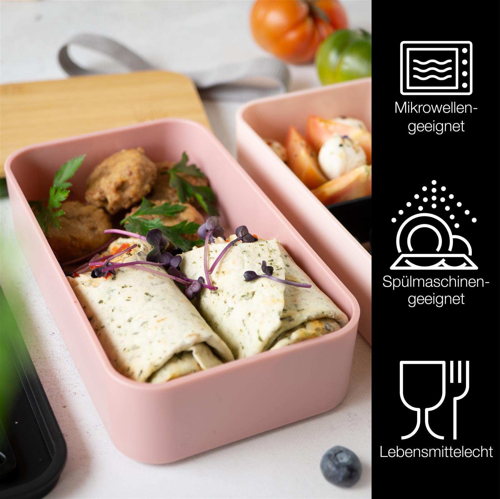 Bentobox in Pink mit Besteck und Lebensmitteln - Moritz und Moritz Bild einer pinken Bentobox mit mehreren Fächern, in denen verschiedene Speisen appetitlich angerichtet sind, ideal für die stilvolle Mitnahme von Mahlzeiten unterwegs.